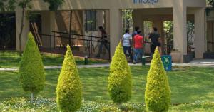 Under political pressure, Infosys says it will hire 10,000 American workers